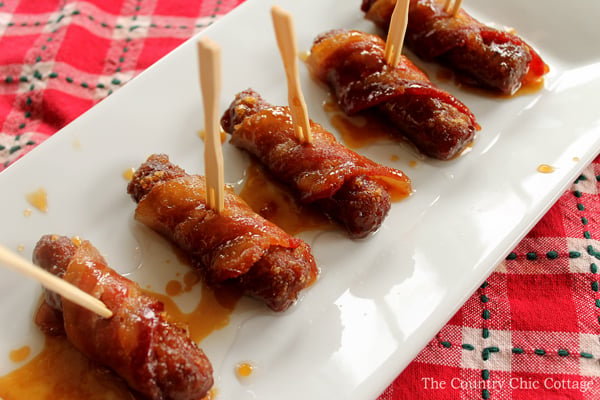 Get this recipe for brown sugar bacon wrapped sausage appetizers today! A super easy recipe that will be the hit of any holiday party!