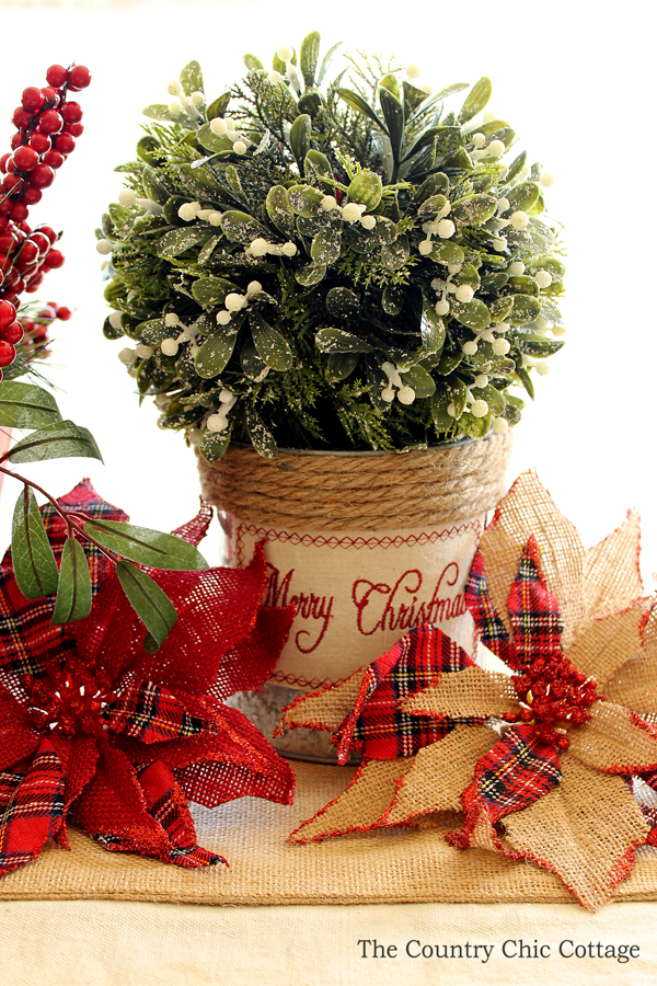 This is a great table centerpiece for Christmas! So easy to put together! I love the burlap poinsettias!