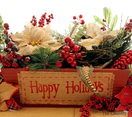 This is a great table centerpiece for Christmas! So easy to put together! I love the burlap poinsettias!