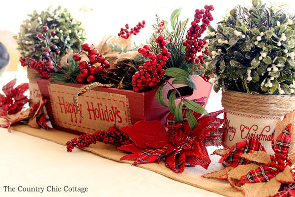 This is a great table centerpiece for Christmas! So easy to put together! I love the burlap poinsettias!