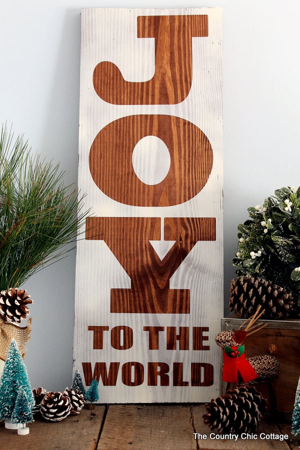 Make this rustic wood sign for Christmas! A super easy project that uses any board that you have on hand!