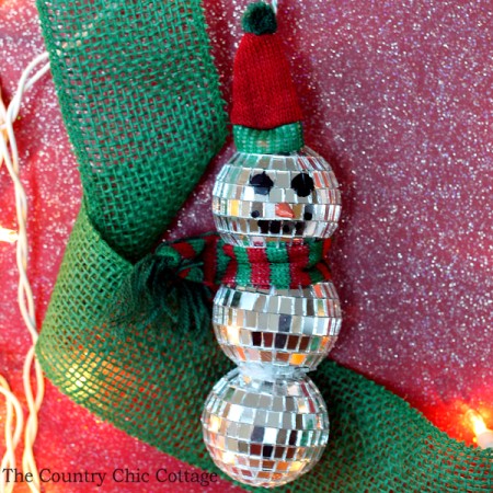 Make this mirror ball snowman ornament in just minutes! A fun craft idea for your Christmas tree!