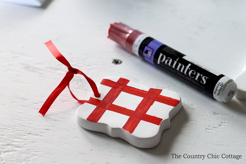 white ornament with thick red lines