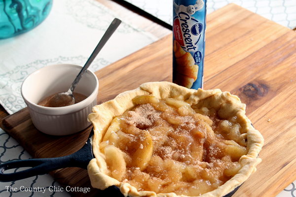 Make this skillet caramel apple pie recipe today! Uses crescent rolls as pie crust for an unexpected twist! So simple to make!