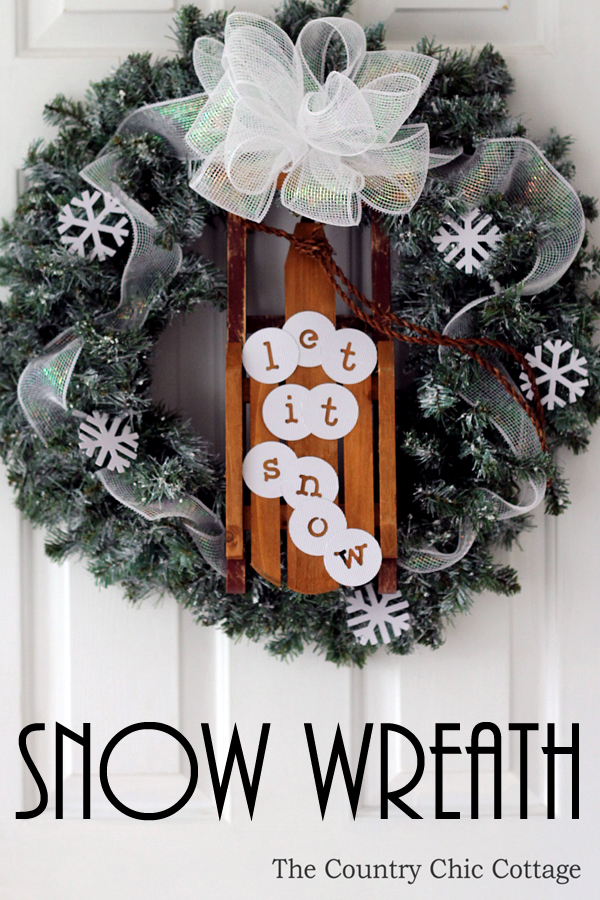 christmas sleigh wreath with "let it snow" in white letters