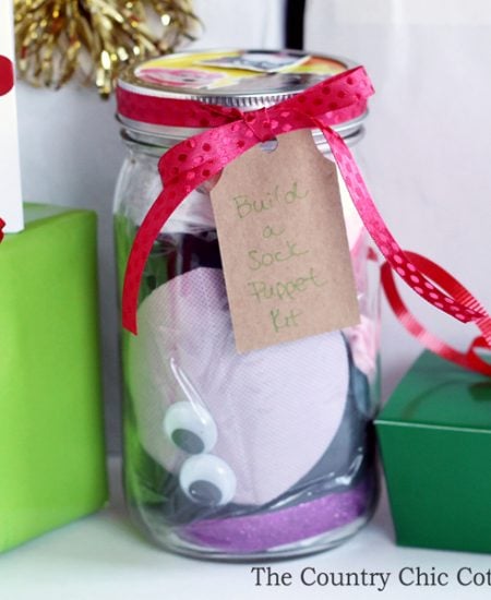 Make this build a sock puppet gift idea in just minutes for every kid on your gift giving list! This is a gift in a jar that is perfect for the holidays, birthdays, and more!