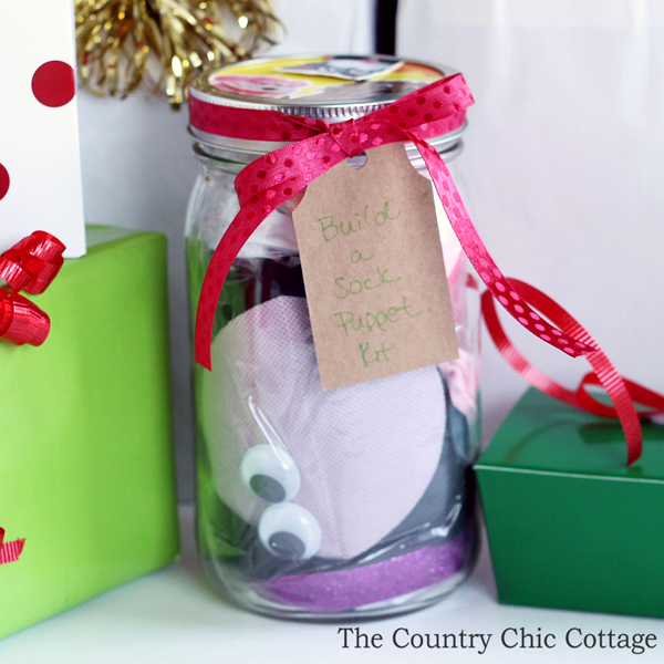 Make this build a sock puppet gift idea in just minutes for every kid on your gift giving list! This is a gift in a jar that is perfect for the holidays, birthdays, and more!