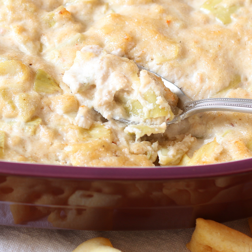 This hot artichoke dip with crab is perfect for any party! Be sure to make some for your next get together!