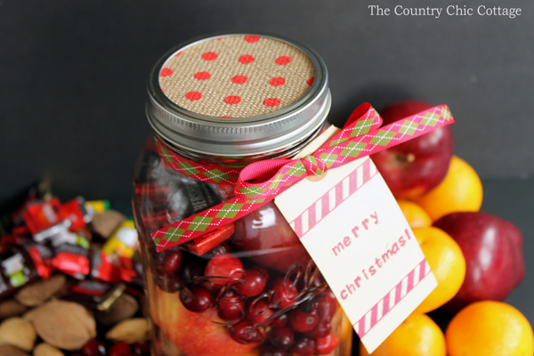 overhead image of assembled fruit basket in a mason jar surrounded by fruits