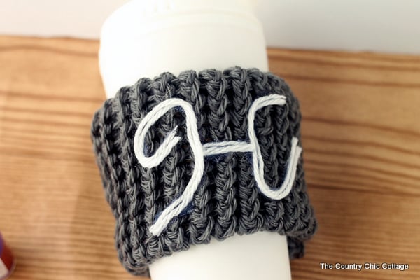 yarn monogram on coffee cup sleeve
