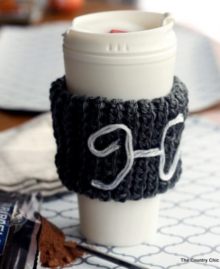 Make this monogram knit coffee sleeve with a knitting loom! This makes a great gift and is a great beginner's project for knitting!