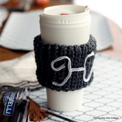 Make this monogram knit coffee sleeve with a knitting loom! This makes a great gift and is a great beginner's project for knitting!