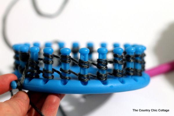 closeup of using a knitting loom