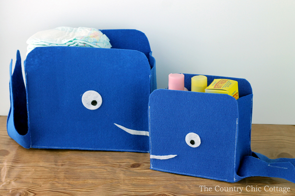 small and large felt storage baskets shaped like a whale