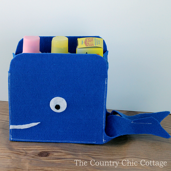 small felt storage baskets shaped like a whale