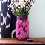 Make this Valentine's mason jar for your Valentine's Day decor! A fun mason jar craft that is perfect as a vase or to give a Valentine's gift. Plus you can make this one in 15 minutes or less!