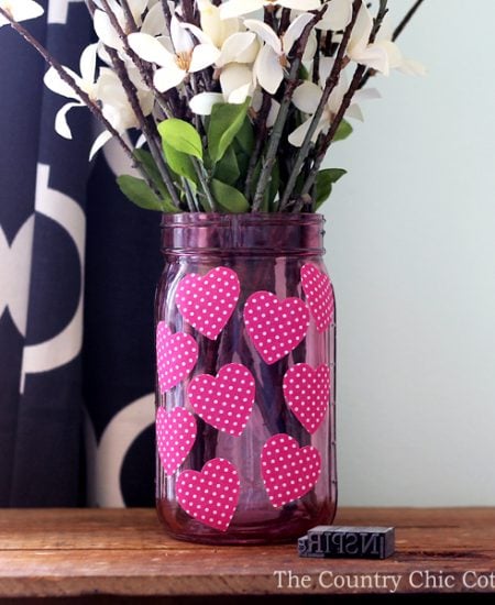 Make this Valentine's mason jar for your Valentine's Day decor! A fun mason jar craft that is perfect as a vase or to give a Valentine's gift. Plus you can make this one in 15 minutes or less!