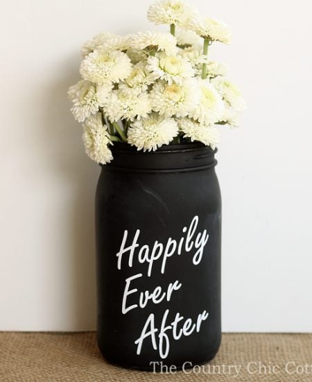 Make this chalkboard mason jar vase in just minutes for your wedding! A fun way to add centerpieces to the tables!