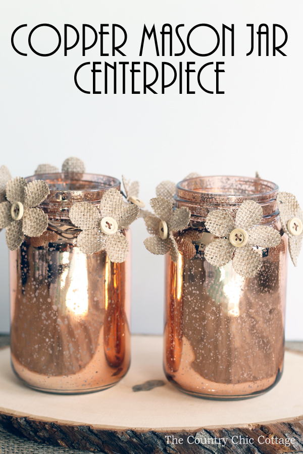  This copper mason jar centerpiece is perfect for weddings and other events! You can make this in minutes and the burlap flowers really add a rustic touch!