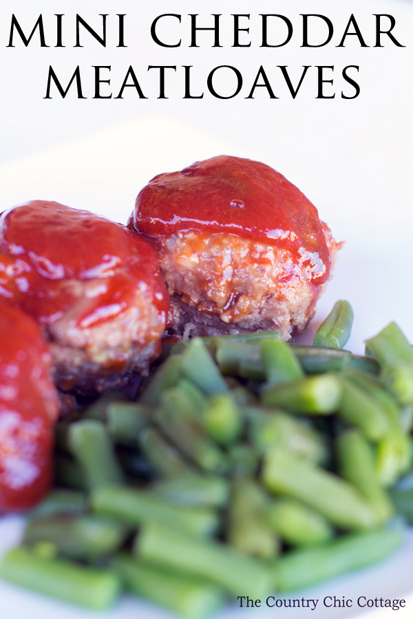 Make these mini cheddar meatloaves in a muffin tin! A great way to eat meatloaf! Plus this meatloaf recipe is delicious with a zesty sauce on the top!