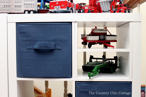 white cube organizer with navy canvas cubes and toys