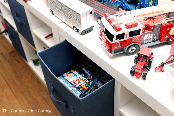 white cube organizer with navy canvas cubes and toys