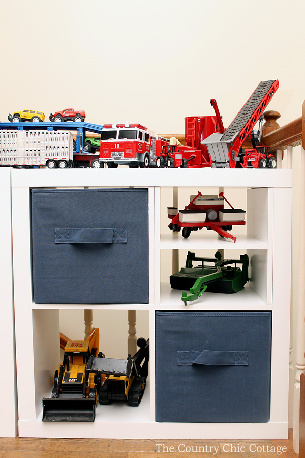 white cube organizer with navy canvas cubes and toys