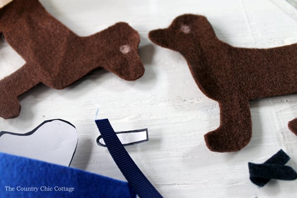 cutting dog shapes with felt 