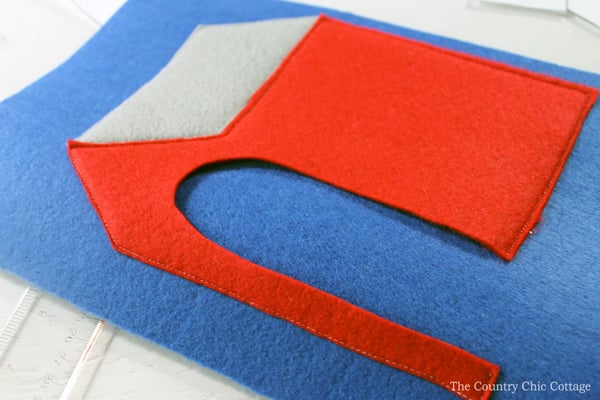 cutting a dog house shape out of felt