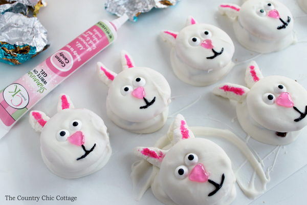 assembling easter bunny cookies on parchment paper