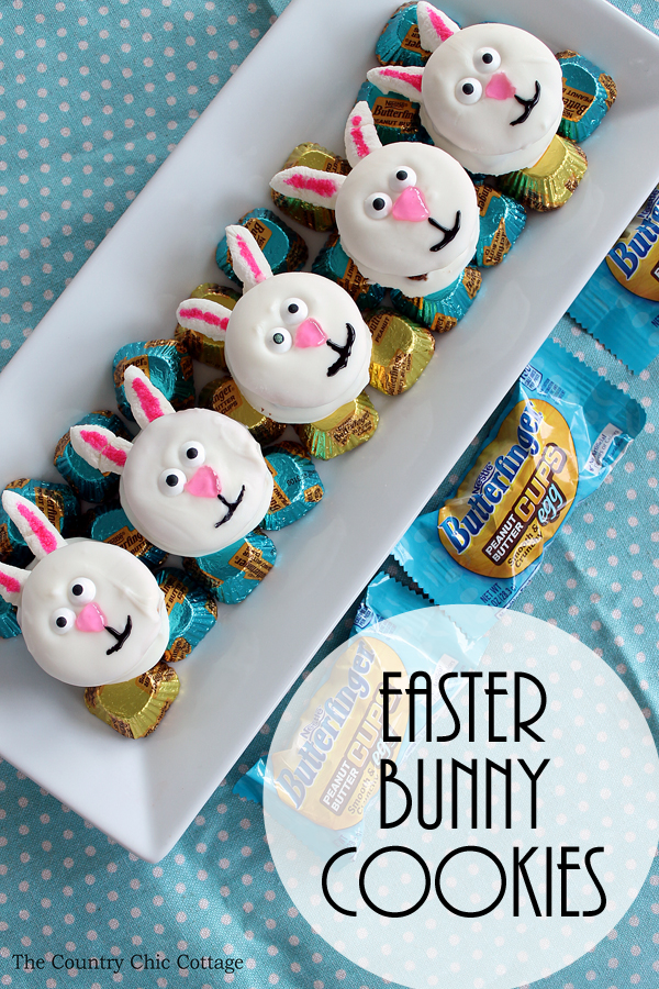 five easter bunny cookies with butterfinger candies on serving platter