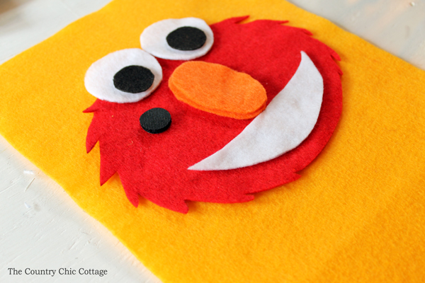 Make this Elmo busy book page for any quiet book you are working on! Toddlers and babies will love putting the nose on Elmo!