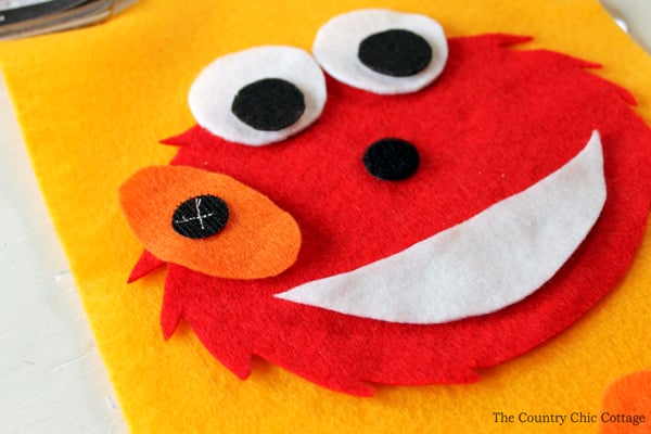 Make this Elmo busy book page for any quiet book you are working on! Toddlers and babies will love putting the nose on Elmo!