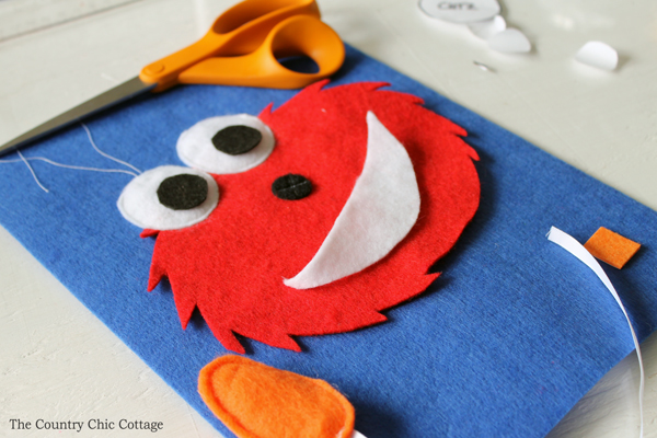 Make this Elmo busy book page for any quiet book you are working on! Toddlers and babies will love putting the nose on Elmo!