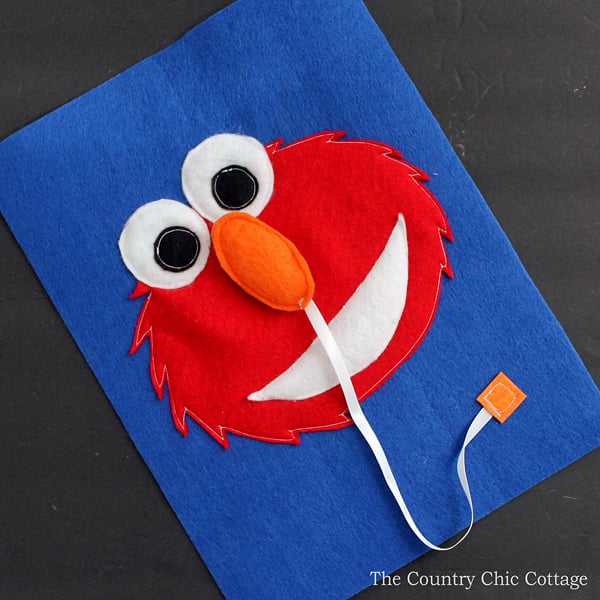 Make this Elmo busy book page for any quiet book you are working on! Toddlers and babies will love putting the nose on Elmo!