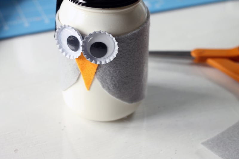 Secure the googly eyes to your mason jar to give your owl some eyes!