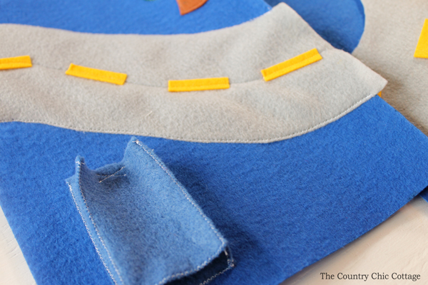 sewing felt items for a busy book page