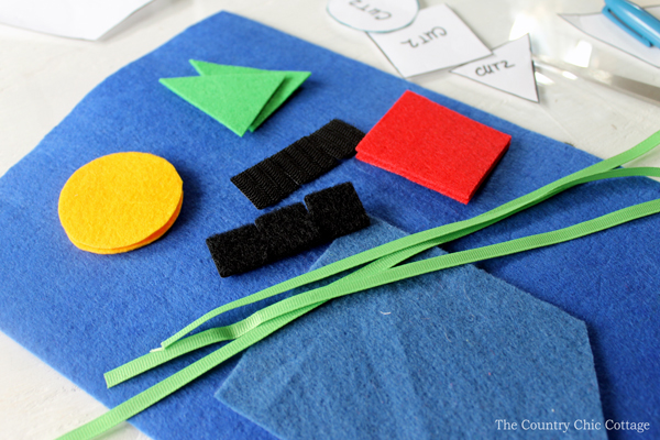 cutting felt, ribbon and velcro.