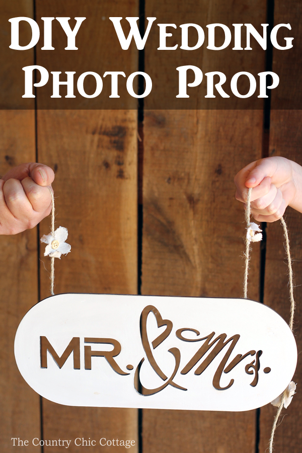 Make this DIY wedding photo prop to capture pictures of the bride and groom on their big day! A super simple craft tutorial that anyone can make!