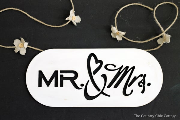 hot gluing wedding twine to mr and mrs sign