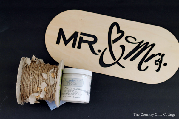 Make this DIY wedding photo prop to capture pictures of the bride and groom on their big day! A super simple craft tutorial that anyone can make!