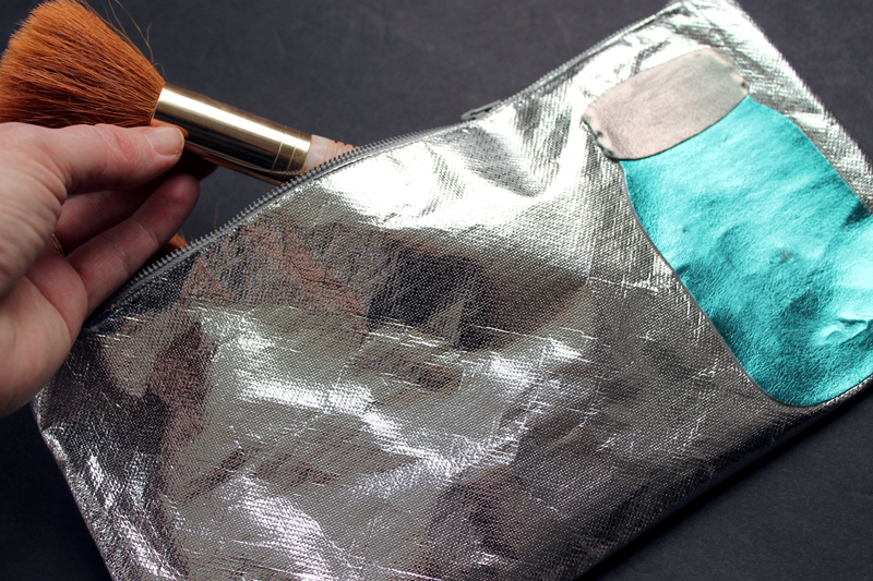 Make this DIY zipper pouch to travel with all of your make up! You can use this great metallic fabric and even add a metallic mason jar if you wish!
