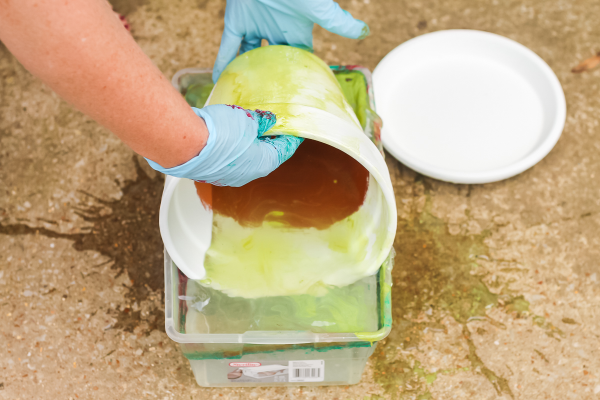 spray paint marbling technique with a clay pot