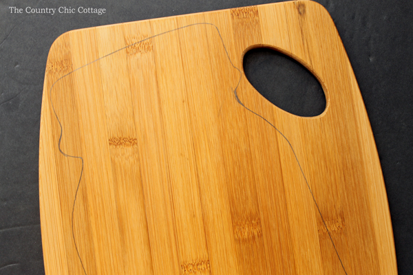 Outlining mason jar on cutting board