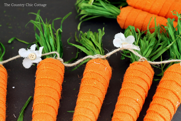 tying carrots onto twine