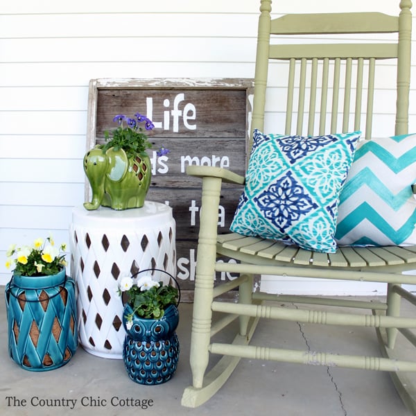 porch rocker with pillows on a porch