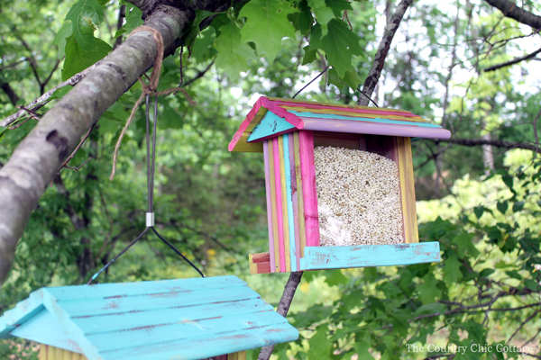 painted wooden feeders for birds