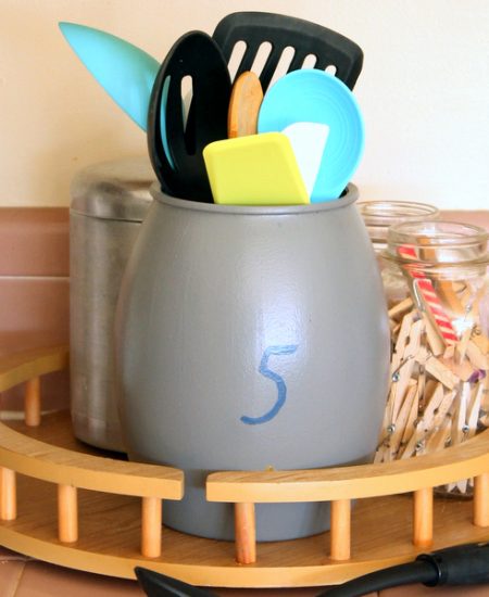 Paint this farmhouse utensil holder with just a crock from the thrift store and a few paints!