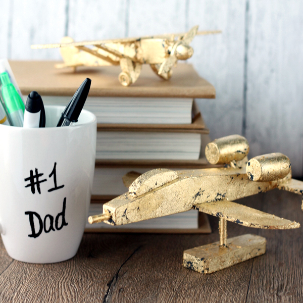 These gold leaf planes with make a perfect Father's Day gift idea! Great for dad's desk at work! See how to make your own here!