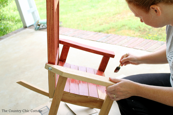 painting red stain on rocking chair